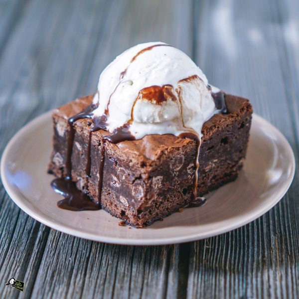 chocolatefudgybrowniewithvanillaicecreamontoppicture